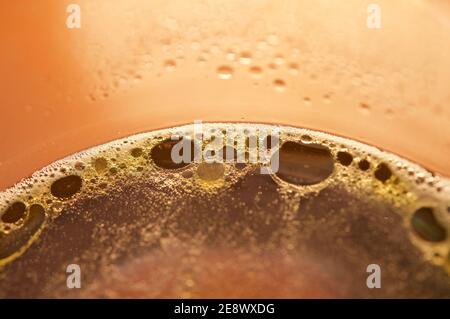 Macro shot of oil drops on soapy water Stock Photo
