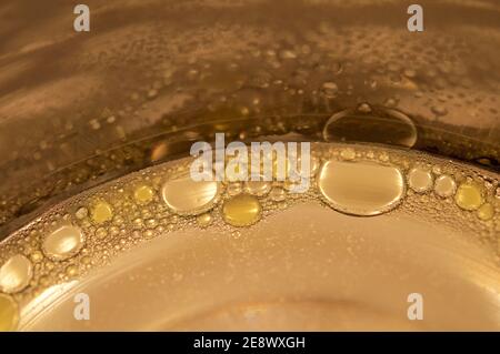 Macro shot of oil drops on soapy water Stock Photo