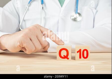 coenzyme q10. essential vitamins and minerals for humans. doctor recommends taking vitamin q10. doctor talks about the benefits of vitamin q10. Vitami Stock Photo