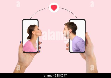 Young couple kissing using smartphones, creative collage Stock Photo