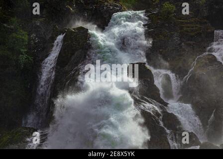 Kleivafossen waterfall, Briksdalselva river, Norway.  The river is fed by the melting Briksdal Glacier (Briksdalsbreen). Stock Photo