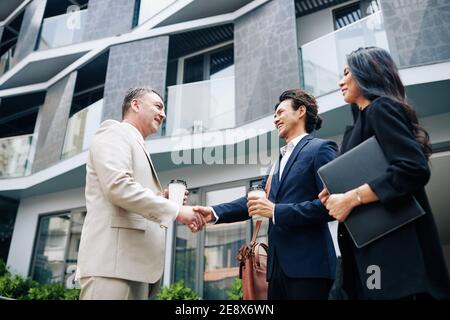 Business partners shaking hands Stock Photo