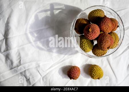 Lychees in vintage glass dish Stock Photo