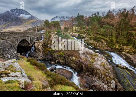 Rhaeadr Ogwen falls and Pen-y-benglog bridge in the winter in Snowdonia, Wales Stock Photo