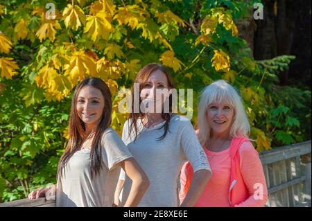Three generations of women in an Autumn setting in Mt. Hood National Forest. Stock Photo