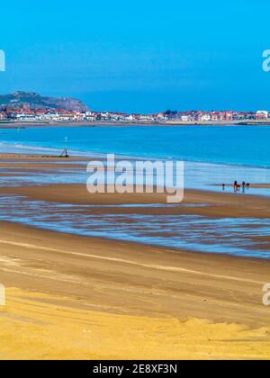 View across the sandy beach at low tide at Colwyn Bay a popular seaside resort in Conwy North Wales UK Stock Photo