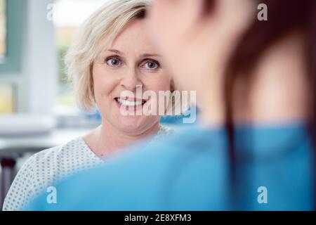 Nurse preparing patient for the coming surgery Stock Photo