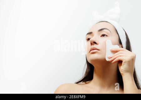 woman using gouache scraper massager Stock Photo