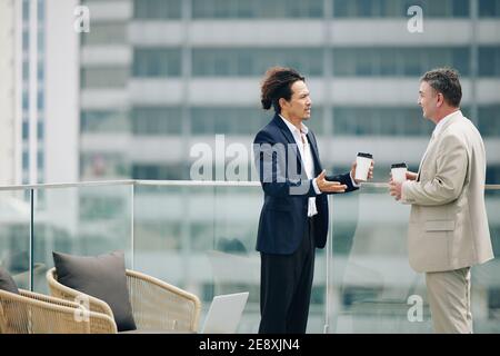 Serious talking business people Stock Photo
