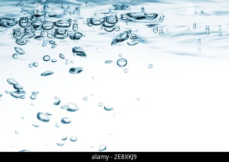 Water blue wave background. Air bubbles in clear water liquid Stock Photo