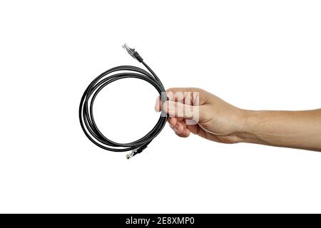 internet or network cable at caucasian person hand. person give cat5e cable. isolated on a white background Stock Photo