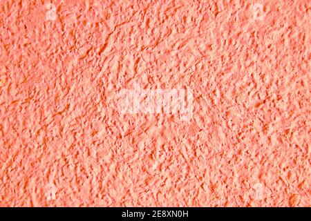 Abstract grainy texture on light orange wall. Design element and background Stock Photo