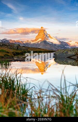 Majestic Matterhorn mirrored in lake Stellisee at dawn, Zermatt, Valais canton, Switzerland