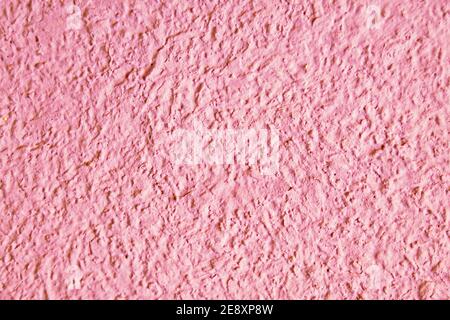 Abstract grainy texture on light pink wall. Design element and background Stock Photo