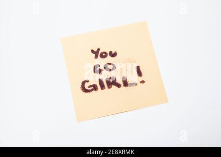 You go girl note on yellow sticky note pad, empowering women concept Stock Photo