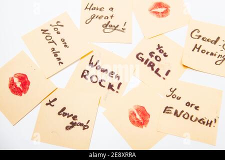 Inspirational empowering feminist notes on yellow sticky papers Stock Photo