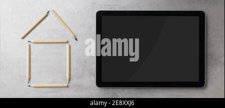 Flat lay top view of tablet and outline of house, housing concept. Copy space. Stock Photo
