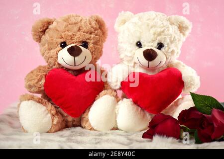 Happy Valentine's Day Teddy Bears With Love hearts gifts on pink and white  fur background Stock Photo - Alamy