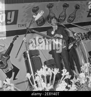The Beatles Paul McCartney on stage with bass guitar Stock Photo