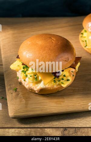 Homemade Bacon Egg Sandwich on a Brioche Bun with Cheese Stock Photo
