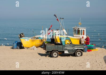 Fishing port in Piaski on Vistula Spit, Poland. Fishermen returning from catching fish. Baltic sea. Stock Photo