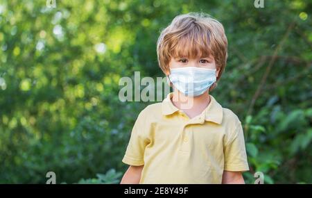 Boy wearing anti virus mask. Little boy wearing a mask to protect him against corona virus covid-19. Child wearing face mask during corona virus and Stock Photo