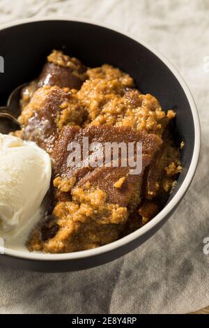 Homemade Cornmeal Indian Bread Pudding with Ice Cream Stock Photo