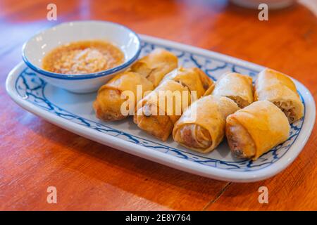 Fried chinese spring rolls with sweet chili sauce. Stock Photo