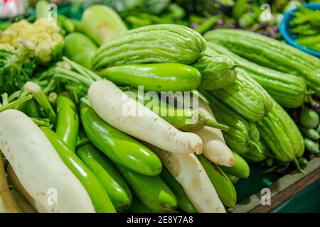 A stall in a market selling assorted vegetables including Stock Photo