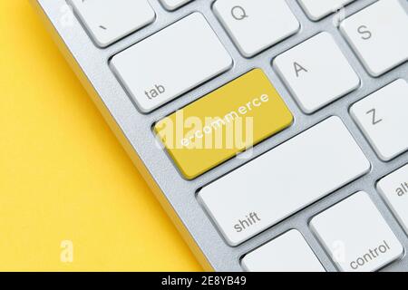 E-commerce concept on keyboard with button close up. Stock Photo