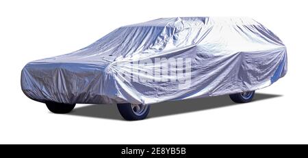 Vintage station wagon under silver car cover isolated and cutout on white background Stock Photo