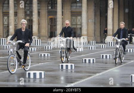 Members of rock band 'The Police', US drummer Stewart Copeland, British singer and bassist Sting (L) and guitarist Andy Summers ride 'Velib' bicycles prior to be awarded into the Order of Arts and Letters by French culture minister, Christine Albanel in Paris, France on October 1, 2007. Photo by Frederic Nebinger/ABACAPRESS.COM Stock Photo