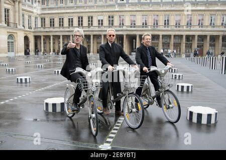 Members of rock band 'The Police', US drummer Stewart Copeland, British singer and bassist Sting (L) and guitarist Andy Summers ride 'Velib' bicycles prior to be awarded into the Order of Arts and Letters by French culture minister, Christine Albanel in Paris, France on October 1, 2007. Photo by Frederic Nebinger/ABACAPRESS.COM Stock Photo