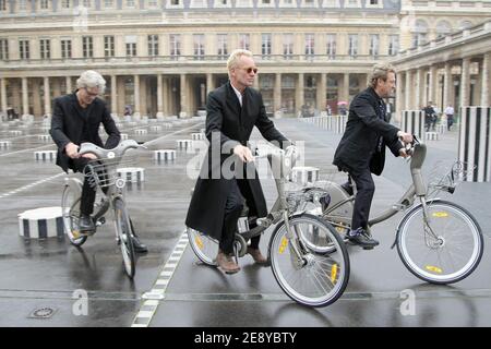 Members of rock band 'The Police', US drummer Stewart Copeland, British singer and bassist Sting (L) and guitarist Andy Summers ride 'Velib' bicycles prior to be awarded into the Order of Arts and Letters by French culture minister, Christine Albanel in Paris, France on October 1, 2007. Photo by Frederic Nebinger/ABACAPRESS.COM Stock Photo