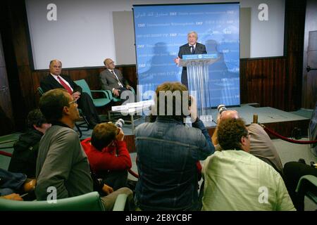 The reflection of French Socialist Dominique Strauss-Kahn, newly appointed at the head of the International Monetary Fund, is seen as he gives a press conference at the IMF's office in Paris, France on October 1st, 2007. Strauss-Kahn, former Economy Minister, was elected 28 September 2007 as IMF new chief as the troubled institution sought to redefine itself in the face of increasing skepticism globally. Photo by Mousse/ABACAPRESS.COM Stock Photo