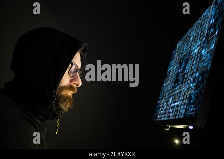 hacker coding at night cybersecurity concept Stock Photo