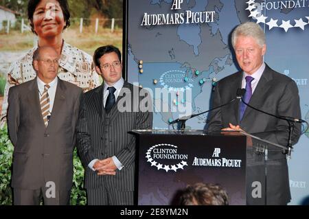 Former US President Bill Clinton R announces a partnership with