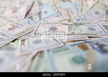 Lot of american dollar bills lying on table closeup Stock Photo