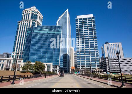 The skyline of Charlotte, North Carolina, viewed from S. Tryon Street in a bright blue sky. Stock Photo