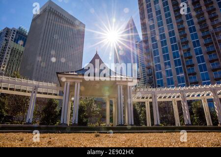 A view of the Charlotte, North Carolina, skyline in a bright blue sky as seen from Romare Bearden Park. Stock Photo