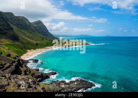 Rocky shoreline and pocket beach at Makapuʻu Point, western end of Oahu, Hawaii