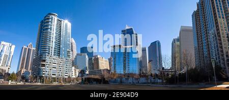 A panoramic view of the Charlotte, North Carolina, skyline in a bright blue sky as seen from Romare Bearden Park. Stock Photo