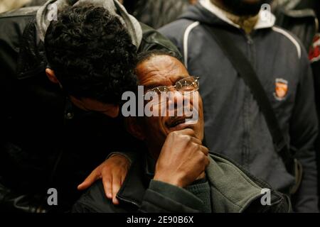 M. Sehhouli (C), the father of Moushin, 15, one of the two teanagers who died yesterday after a collision between a motorcycle and a police car, is comforted before the start of a press conference in Villiers-le-Bel, outside Paris, France, on November 26, 2007. Young people burnt cars and bins yesterday as a reaction of the death of the two teenagers. Photo by Mehdi Taamallah/ABACAPRESS.COM Stock Photo