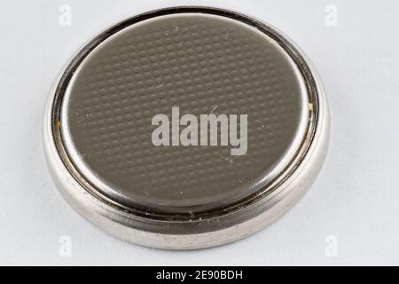 A CR2032 button cell lithium battery isolated Stock Photo