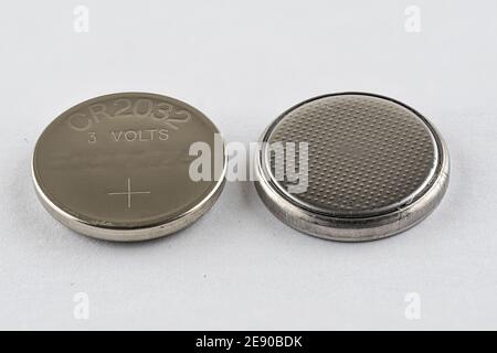 A CR2032 button cell lithium battery isolated Stock Photo