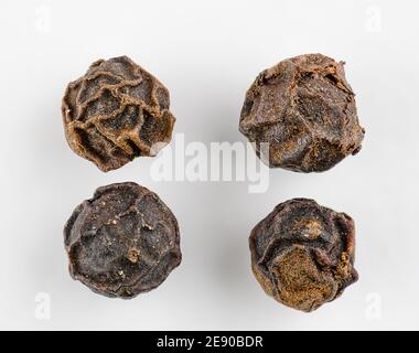Black Pepper Corn Macro image on a white background Stock Photo