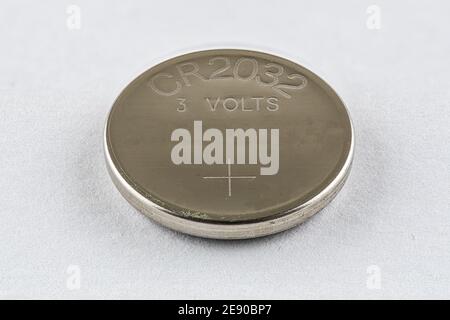 A CR2032 button cell lithium battery isolated Stock Photo