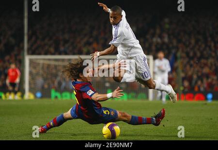 Real Madrid's Robinho is challenged by FC Barcelona's Carles Puyol during the Spanish League soccer match, FC Barcelona vs Real Madrid at the Camp Nou Stadium in Barcelona, Spain on December 23, 2007. Real Madrid won 1-0. Photo by Christian Liewig/ABACAPRESS.COM Stock Photo