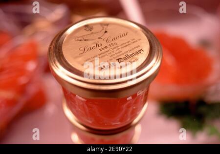 Closed glass jar of red salmon caviar at delicatessen shop Stock Photo