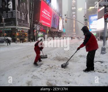 Manhattan, New York, USA. 1st Feb, 2021. Workers shovel the snow in Times Square during the first major snow storm of the 2021 season in New York City. Mayor Bill de Blasio called for a state of emergency and only essential workers were working. Some areas got over 2 feet of snow. Credit: Debra L. Rothenberg/ZUMA Wire/Alamy Live News Stock Photo